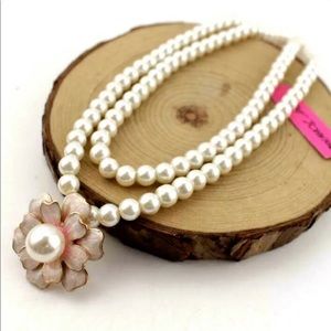 Elegant pearl necklace with enhancer